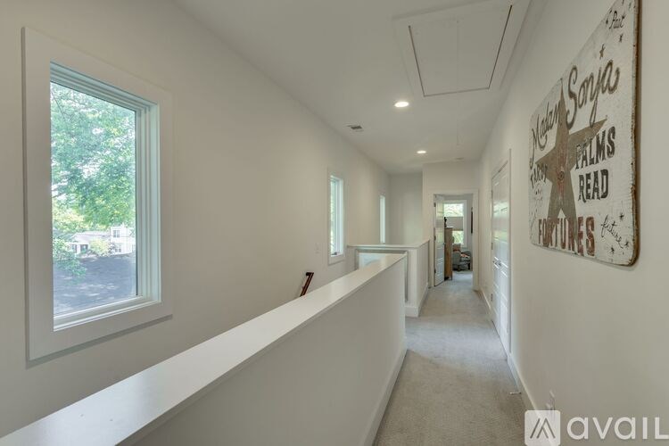 A long hallway with a sign on the wall that says "Happy Sunday".
