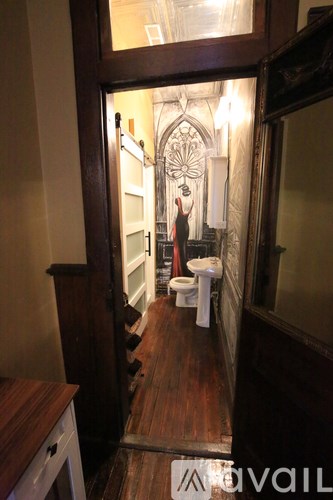 A bathroom with a toilet and a sink.