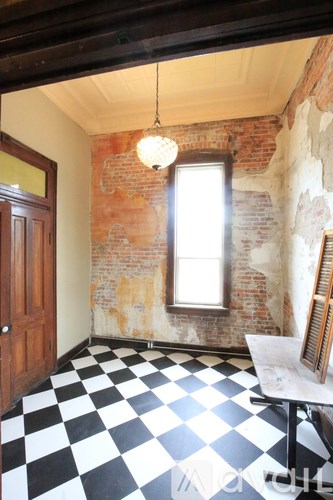 A room with a black and white checkered floor.