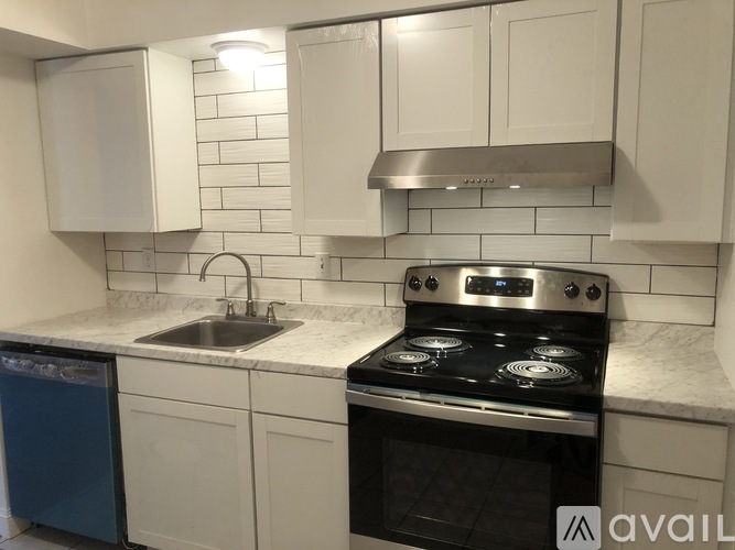 A kitchen with a stove top oven and a microwave.