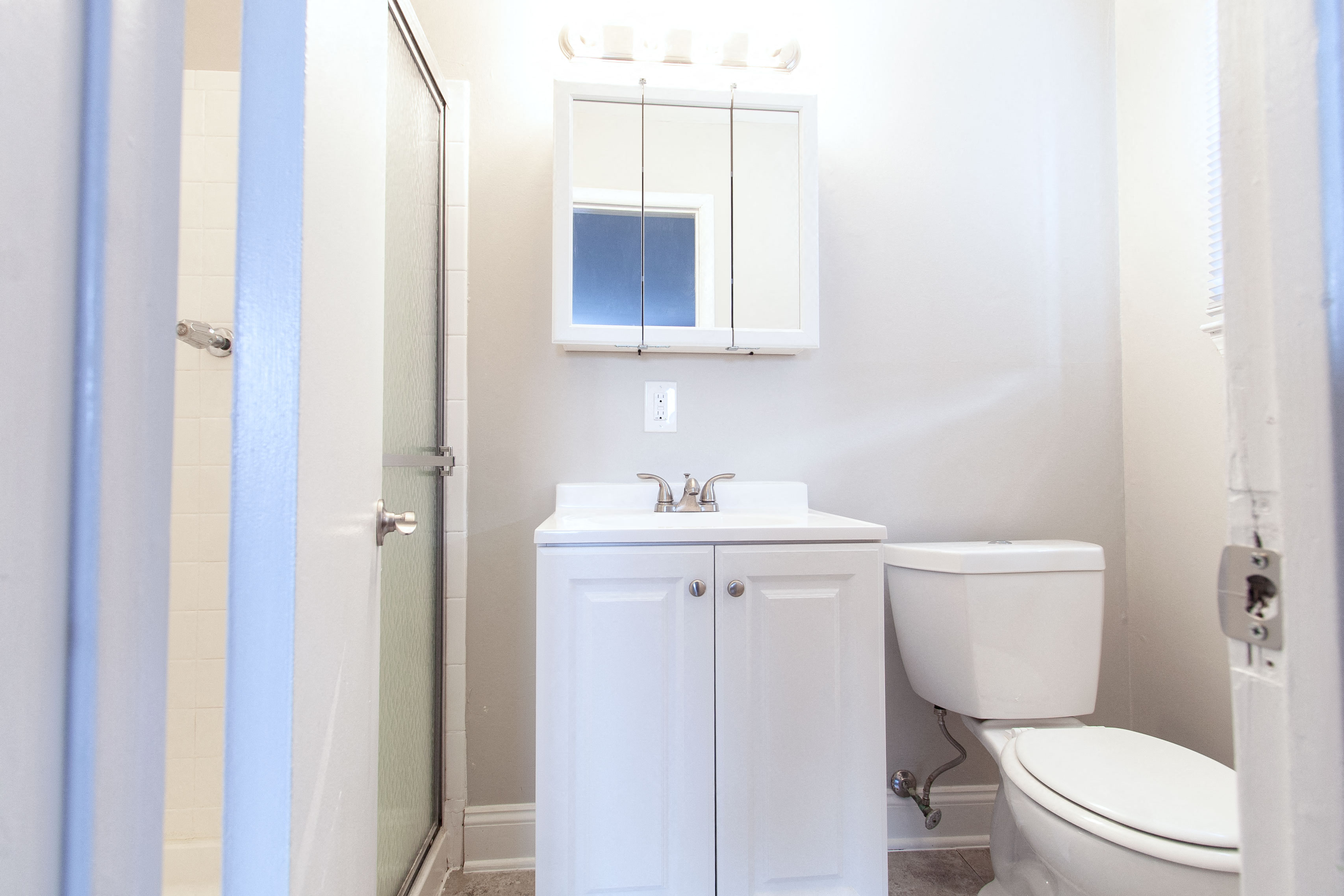 a bathroom with a sink toilet and a shower