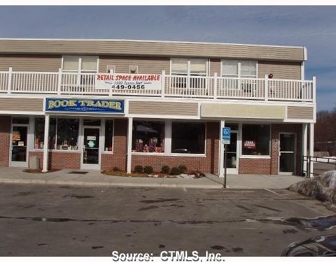 A bookstore with a sign that says Book Trader.