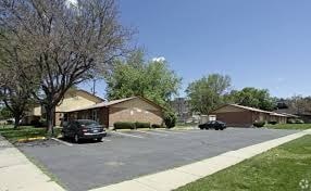 A residential area with houses and cars.