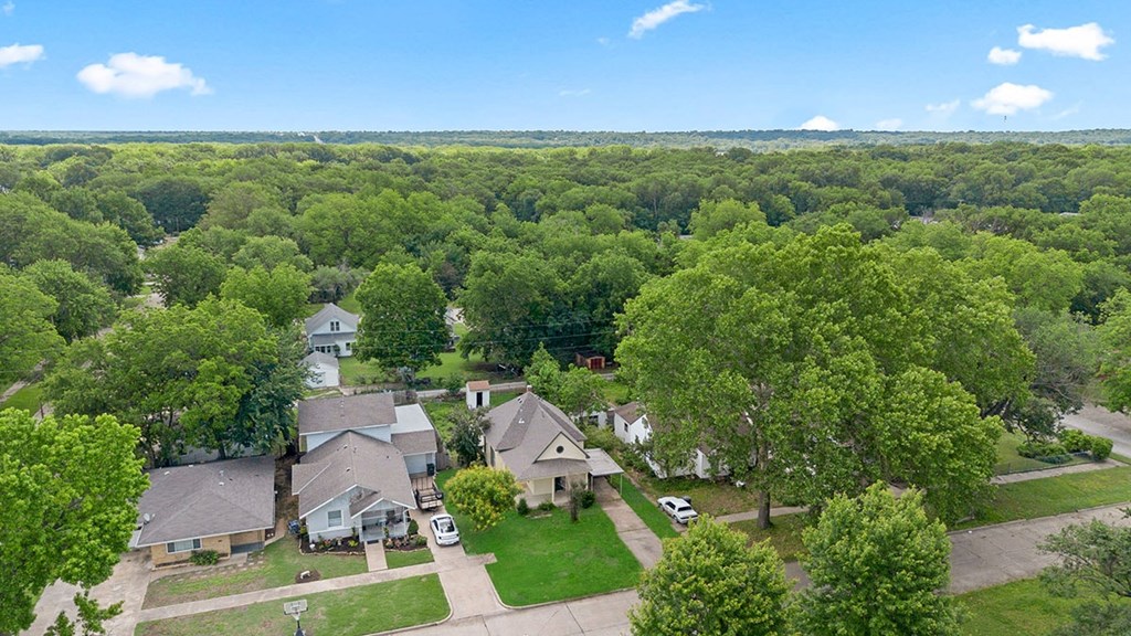 A suburban neighborhood with houses and trees.