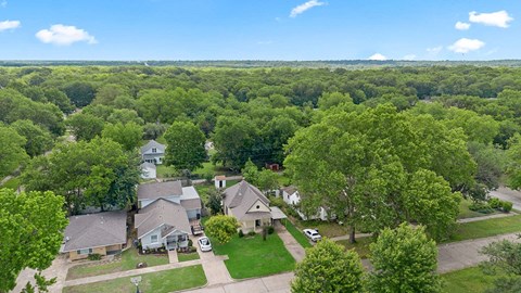 A suburban neighborhood with houses and trees.
