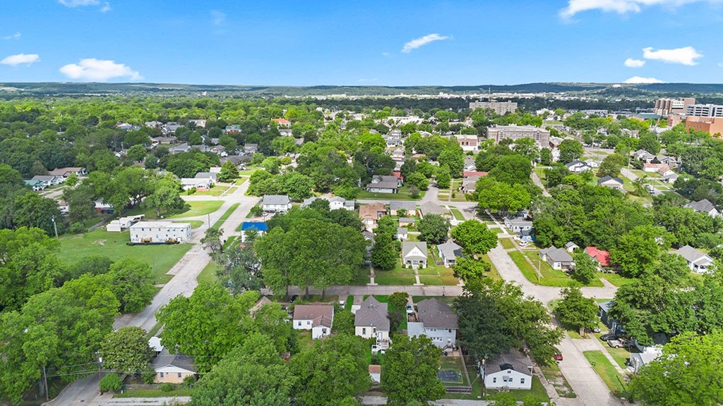 A suburban neighborhood with houses and trees.