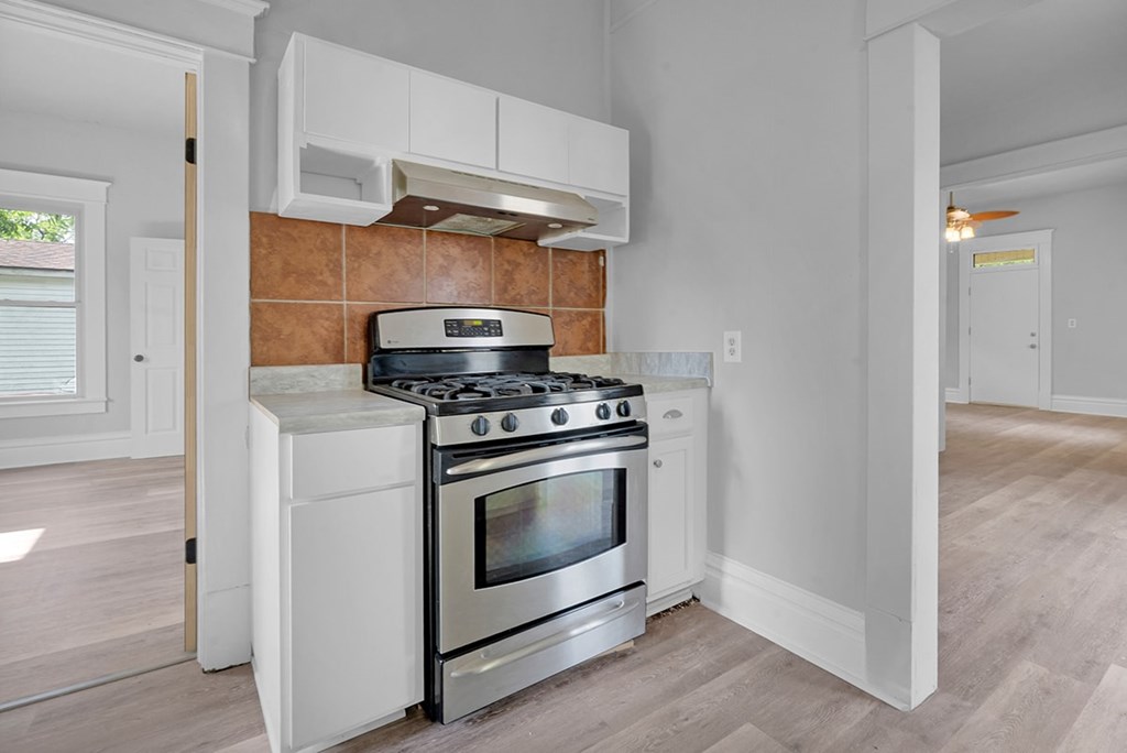 A modern kitchen with a stove and oven.