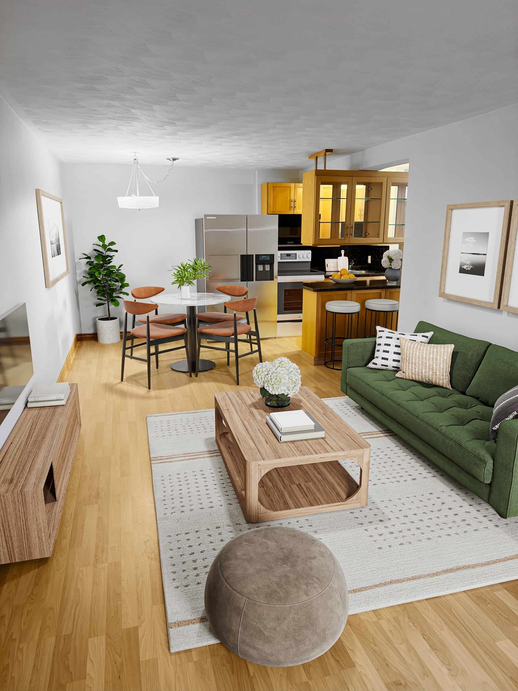 A modern living room with a green couch and wooden furniture.