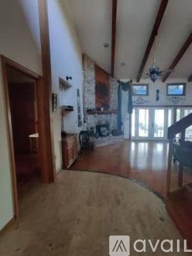 A living room with a couch and a fireplace.