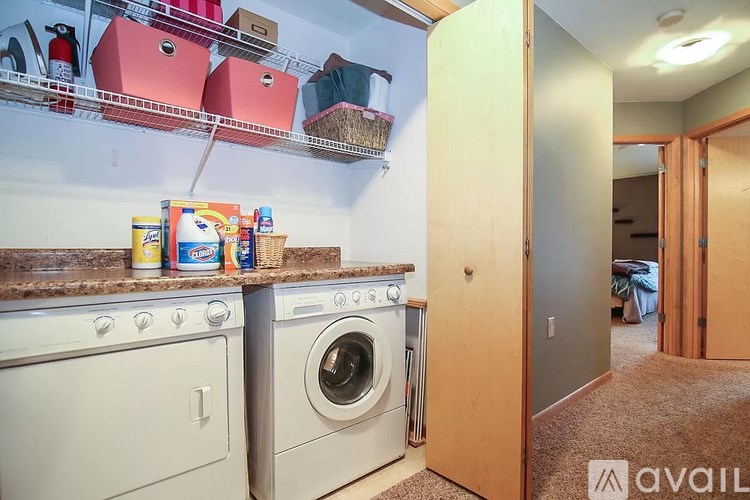 A kitchen with a washer and dryer in it.
