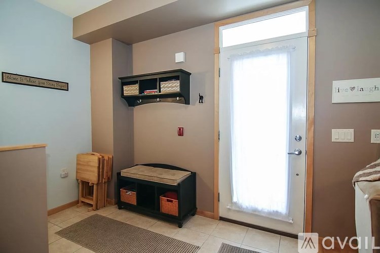 A room with a bed and a cabinet.