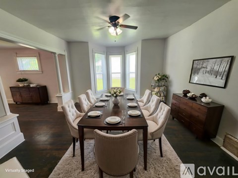 A kitchen with a white stove and a wooden table.