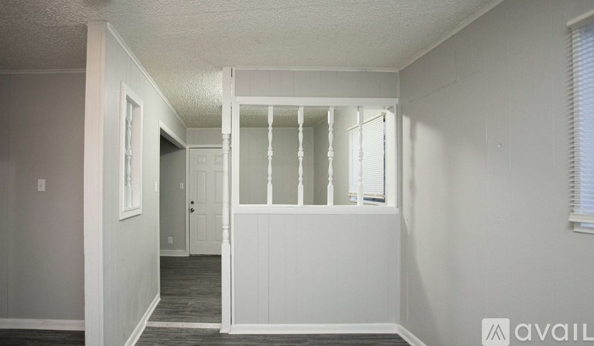 A room with a door and a window.