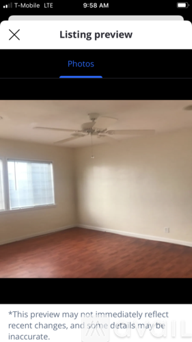 A room with a ceiling fan and a window.