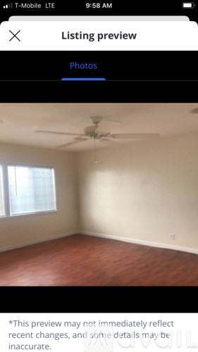 A room with a ceiling fan and a window.