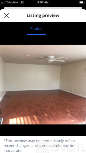 A room with wooden flooring and a ceiling fan.