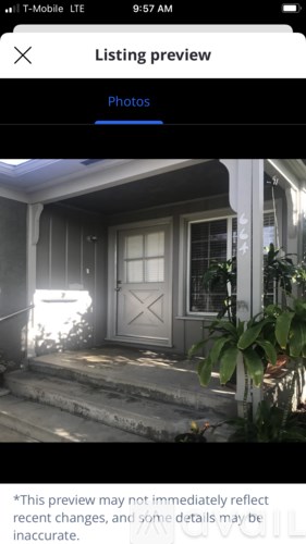 A house entrance with a door and steps.
