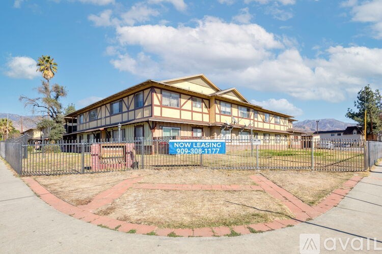 A house with a sign that says "NOW LEASING" is for rent.