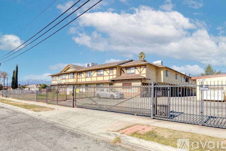 A house with a fence in front of it.
