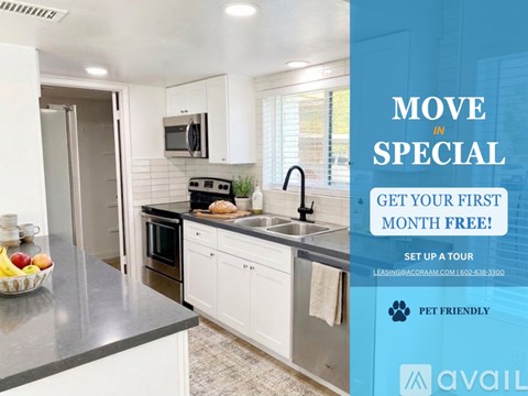 A kitchen with a refrigerator, stove, and cabinets is on display with an offer for a first month free.