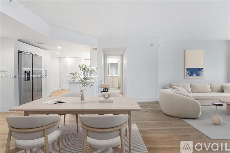 A modern dining room with a wooden table and chairs.