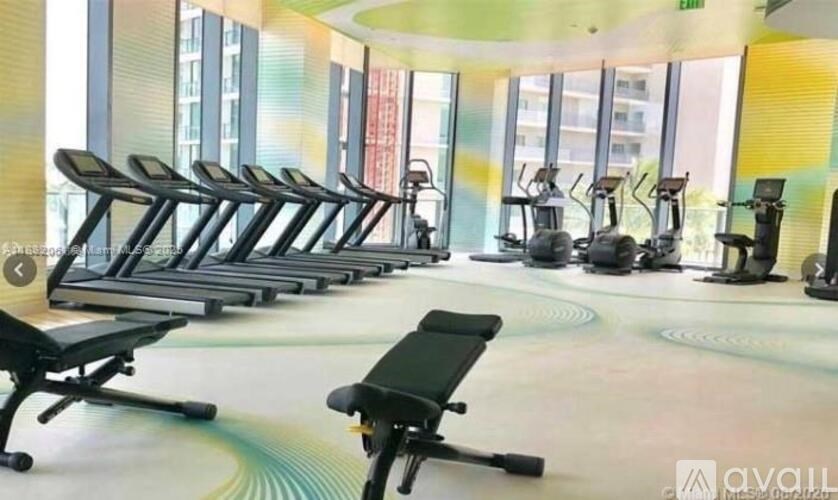 A gym with treadmills and exercise bikes.