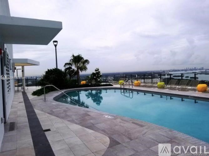 A pool with a view of the ocean.