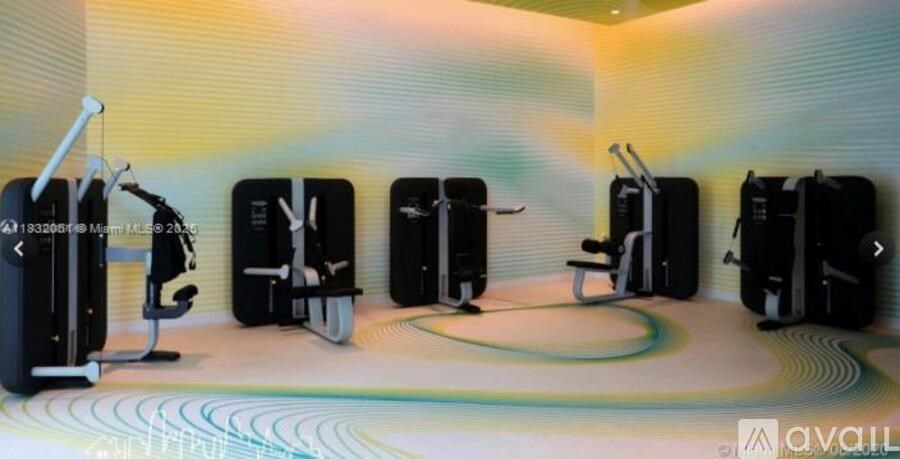 A row of treadmills are lined up in a row.