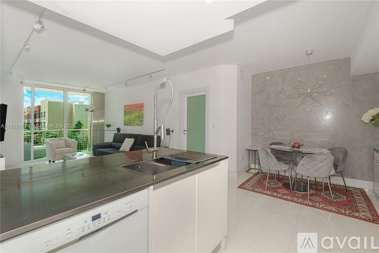 A modern kitchen with a dining table set up.