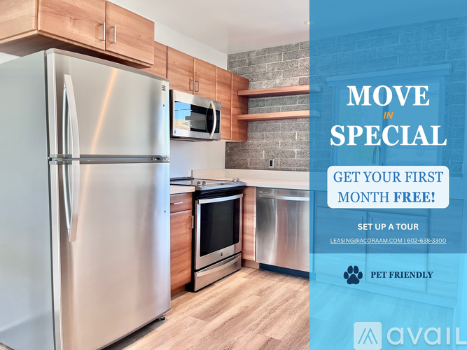 A kitchen with a refrigerator, microwave, and oven is on display for a move-in special.