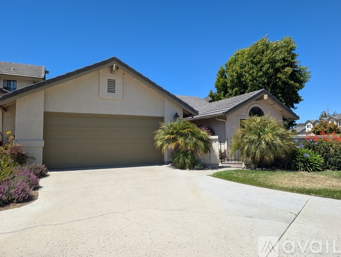 A house with a garage and a driveway.