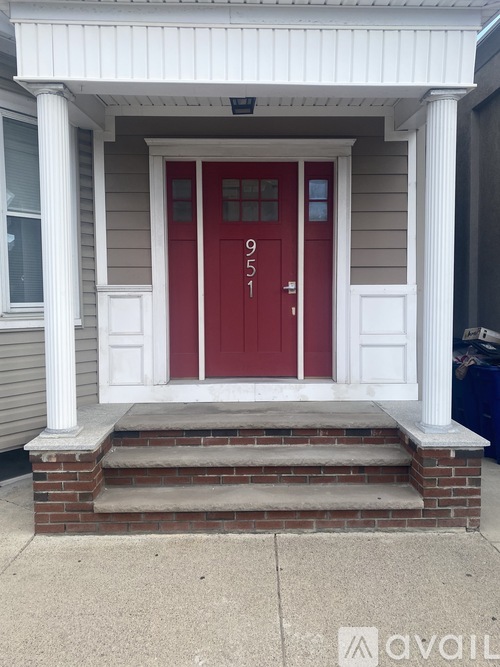 A red door with the number 91 on it.