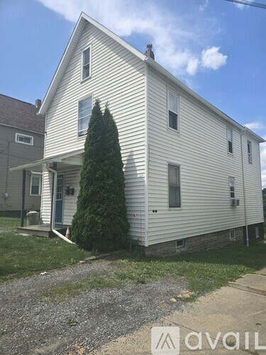 A white house with a blue sky in the background.
