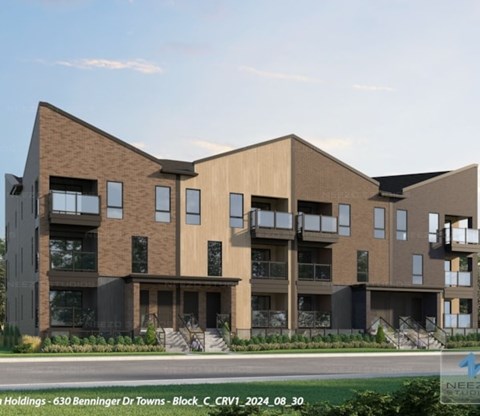 A modern building with a brown and beige facade and black accents.
