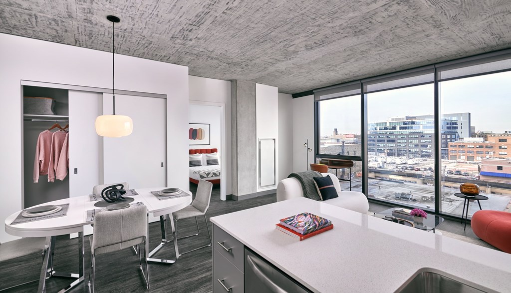 A modern kitchen with a view of the city.