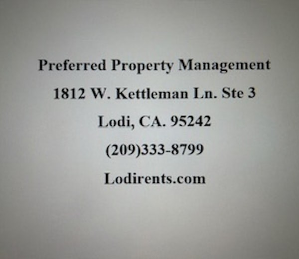 A business card for Preferred Property Management with contact information.