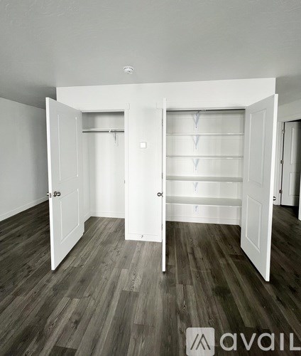 A small bathroom with a white cabinet and sink.