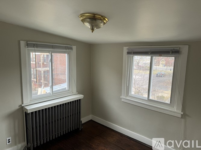 A room with a window and a radiator.