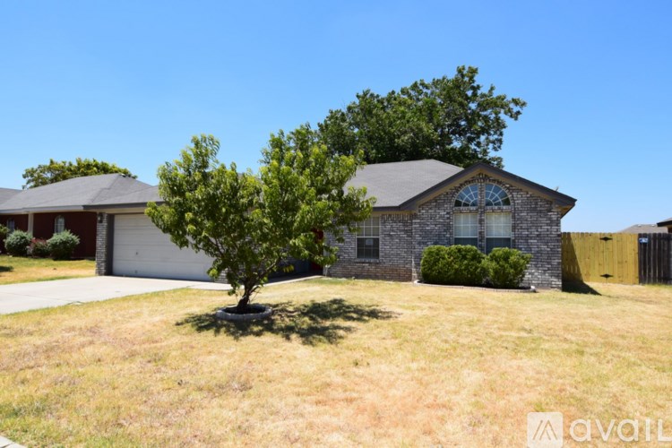 A house with a tree in front of it.