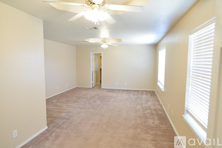 A kitchen with wooden cabinets and a white refrigerator.