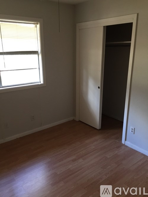 A room with a door and a window.