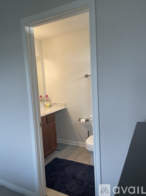 A bathroom with a toilet and sink.