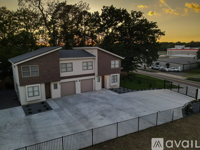 A house with a brown and beige exterior is available for sale.