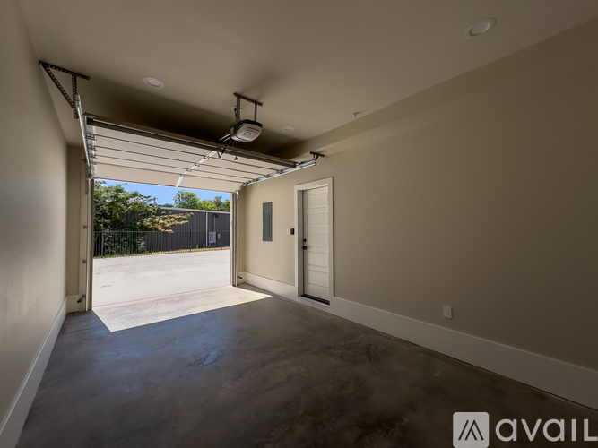 A spacious garage with a sliding door is available for rent.