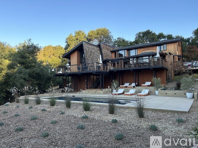 A modern house with a pool in the backyard.