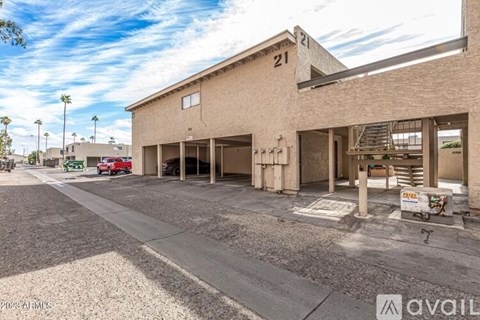 A building with the number 21 on it is for sale.