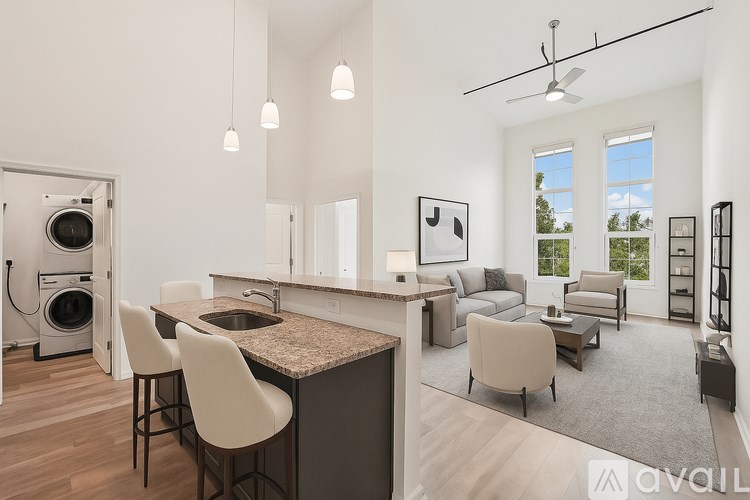 A white toilet sits next to a bathtub in a bathroom.