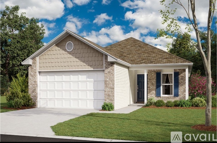 A house with a white garage door and a brown roof.
