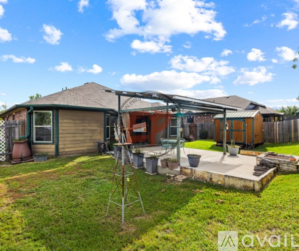 A house with a green lawn and a wooden deck.
