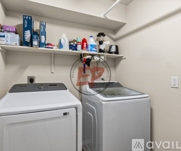 A laundry room with a washer and dryer.